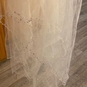 Waist length cream veil with comb and beading